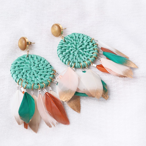 Festival jewellery inspiration with feathers and rattan pendants