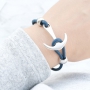 Bracelets and rings with anchors in blue shades