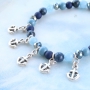 Bracelets and rings with anchors in blue shades