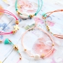 Summery bracelets with coloured elastic cord and colourful beads