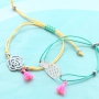 Bracelets of coloured cord with cute summery charms of stainless steel