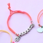 Bracelets of coloured cord with cute summery charms of stainless steel