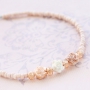 Minimalist flower jewellery with rose beads and daisy flower beads