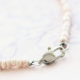 Minimalist flower jewellery with rose beads and daisy flower beads