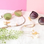 Summer proof: sunglasses cords with golden details and minimalist earrings
