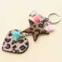 Keychains with pendants faux leather hairy, stainless steel and cheerful tassels