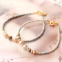 Colourful bracelets of faceted beads with golden details