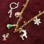 Cheerful Christmas jewellery with gold and silver Christmas charms