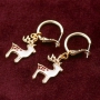 Cheerful Christmas jewellery with gold and silver Christmas charms