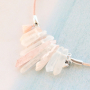 Earrings and necklaces with drop shaped natural stone beads and aura quartz crystal