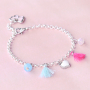 Girly jewellery with cheerful metal charms and soft colours
