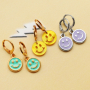 Get creative with these trendy plexx and DQ metal smiley charms