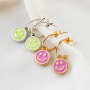 Get creative with these trendy plexx and DQ metal smiley charms