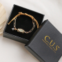 Design jewellery with stainless steel and brass metal C.U.S&reg; jewellery message beads