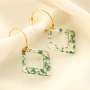 Create statement earrings with resin pendants