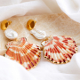 Get creative with large shell pendants