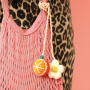 Create trendy keychains with crocheted and resin pendants