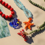 Make colourful necklaces with glass charms