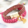 Fashionably bracelets made of waxed cord with different items of Designer Quality metal
