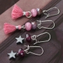 Trendy jewellery made of facet cut natural stone beads in pink and grey shades
